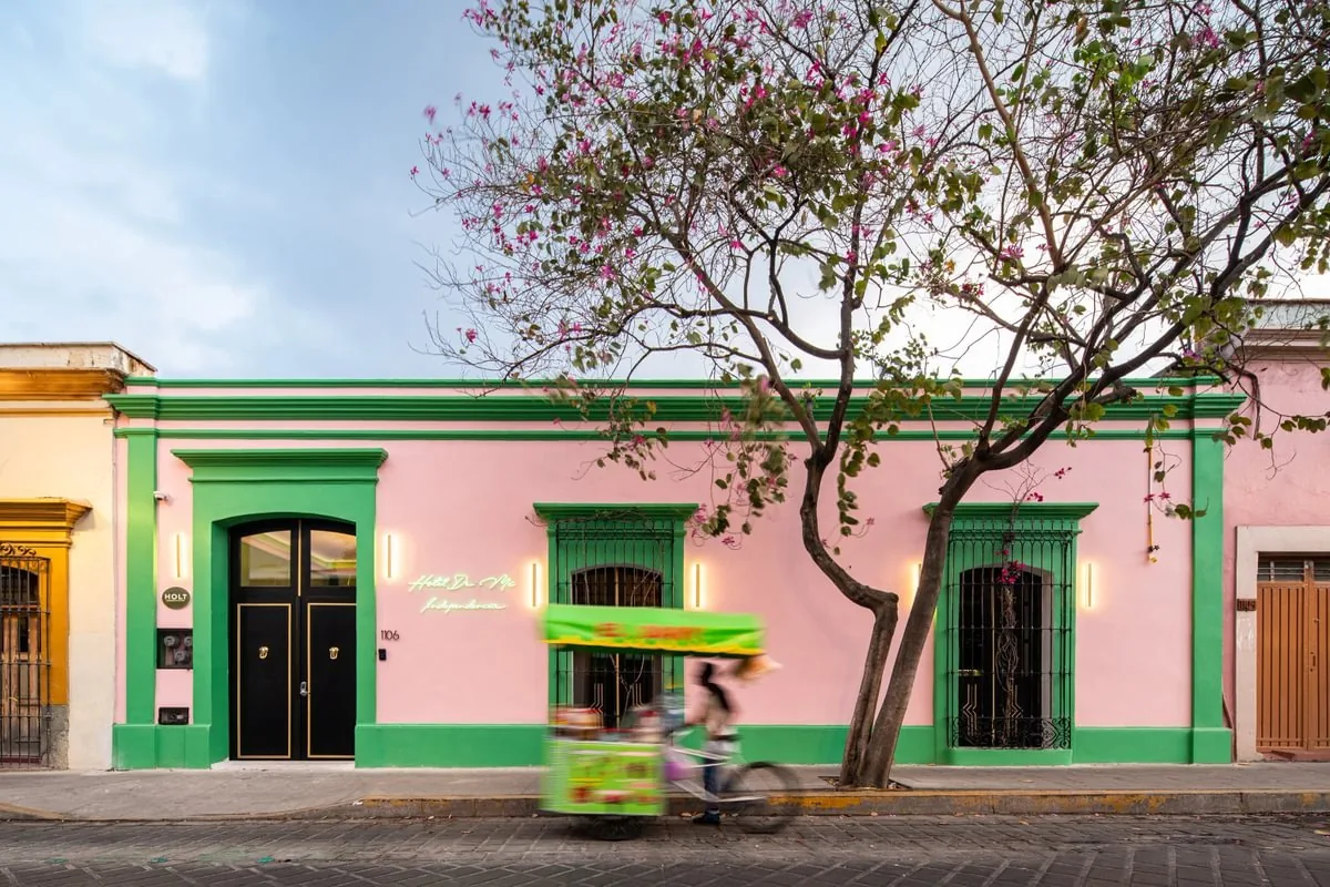 Pink and green street facade of Hotel De Mi Independencia in Oaxaca's Centro Historico